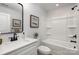Bathroom with a shower-tub combination, a single sink vanity and a framed mirror at 903 Cathey Rd, Charlotte, NC 28214