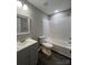 Updated bathroom with subway tile and gray vanity at 9103 Exbury Ct, Charlotte, NC 28269