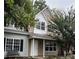 Two-story townhome with gray siding, white accents, and a small front yard at 9103 Exbury Ct, Charlotte, NC 28269