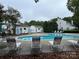 Community pool with lounge chairs at 9103 Exbury Ct, Charlotte, NC 28269