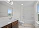 Bright bathroom with white fixtures, a tub-shower combo, and a wooden vanity at 110 Shay Crossing Rd # 1P, Salisbury, NC 28144
