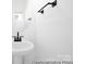 Modern bathroom featuring sleek fixtures, a stylish round mirror, and ample natural light at 110 Shay Crossing Rd # 1P, Salisbury, NC 28144