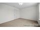 Bedroom with neutral carpet, a door, and natural light at 110 Shay Crossing Rd # 1P, Salisbury, NC 28144