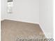 Bright bedroom with neutral carpet, white walls, and a large window at 110 Shay Crossing Rd # 1P, Salisbury, NC 28144