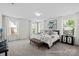 Bright bedroom with large windows, neutral decor, and a comfortable seating area at 110 Shay Crossing Rd # 1P, Salisbury, NC 28144