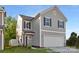 Charming two-story home featuring gray siding, black shutters, and an attached two-car garage at 110 Shay Crossing Rd # 1P, Salisbury, NC 28144