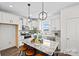 Stylish kitchen with granite island, stainless appliances, white cabinets, and pendant lighting at 110 Shay Crossing Rd # 1P, Salisbury, NC 28144