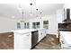 Open-concept kitchen with stainless steel appliances, white cabinets and a large island with bar seating at 110 Shay Crossing Rd # 1P, Salisbury, NC 28144