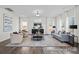 Spacious living room with neutral tones, contemporary furniture, and bright windows at 110 Shay Crossing Rd # 1P, Salisbury, NC 28144