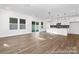 Bright open-concept living space with hardwood floors and sliding glass doors to the backyard at 110 Shay Crossing Rd # 1P, Salisbury, NC 28144