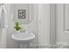Stylish powder room with a pedestal sink, modern fixtures, and a decorative mirror at 110 Shay Crossing Rd # 1P, Salisbury, NC 28144