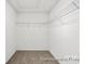Walk-in closet with carpeted floors, and wire shelving at 110 Shay Crossing Rd # 1P, Salisbury, NC 28144