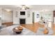 Inviting living area boasts an open layout, fireplace, and seamless flow to dining at 1101 S Wendover Rd, Charlotte, NC 28211