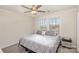 Cozy bedroom features a ceiling fan and a window with neighborhood views at 1111 Fairbrae Ln, Indian Trail, NC 28079