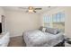 Cozy bedroom features a ceiling fan and a window with neighborhood views at 1111 Fairbrae Ln, Indian Trail, NC 28079