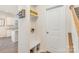 Functional mudroom with storage bench, coat hooks, and access to the kitchen at 1111 Fairbrae Ln, Indian Trail, NC 28079