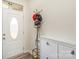 Clean entryway with storage cabinet, coat rack, and oval window door at 1111 Fairbrae Ln, Indian Trail, NC 28079