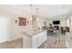 Elegant kitchen island with granite countertops connecting to the dining and living area at 1111 Fairbrae Ln, Indian Trail, NC 28079
