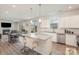 Open-concept kitchen with granite island, stainless appliances, and seamless flow to dining area at 1111 Fairbrae Ln, Indian Trail, NC 28079