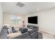 Cozy living room features a large sectional sofa and entertainment center with fireplace at 1111 Fairbrae Ln, Indian Trail, NC 28079