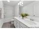 Well-lit bathroom with double sinks, vanity with drawers, and a shower-tub combo with bright white finishes at 112 Stonewater Dr # 33P, Red Cross, NC 28129