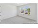 Bedroom featuring neutral walls, carpeted floors and two large windows at 112 Stonewater Dr # 33P, Red Cross, NC 28129