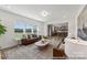 Bright living room with a large window, hard surface floors, neutral walls and access to the kitchen at 112 Stonewater Dr # 33P, Red Cross, NC 28129