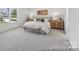 Main bedroom with neutral walls, carpeted floors, and a large window with a view at 112 Stonewater Dr # 33P, Red Cross, NC 28129
