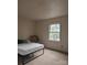 Bright bedroom with neutral carpet and natural light from the window at 115 Eastcliff Se Dr # 4, Concord, NC 28025