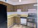 Functional kitchen area with laminate countertops, wooden cabinets and standard appliances at 115 Eastcliff Se Dr # 4, Concord, NC 28025