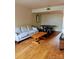 Open-concept living room featuring hardwood floors and minimalist furniture at 115 Eastcliff Se Dr # 4, Concord, NC 28025