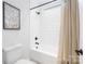 Bathroom featuring white subway tile surround, black fixtures, and neutral-colored shower curtain at 120 Random Dr, Salisbury, NC 28147
