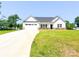 Charming single-story home boasting a well-manicured lawn, a two-car garage and long driveway at 120 Random Dr, Salisbury, NC 28147
