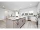 Spacious kitchen includes an island with barstool seating, stainless appliances, and ample counter space at 120 Random Dr, Salisbury, NC 28147