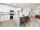 Modern kitchen boasts white cabinetry, stainless steel appliances, and a large island with seating at 120 Random Dr, Salisbury, NC 28147