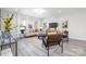Contemporary living room filled with comfortable seating, neutral walls, and large windows for ample light at 120 Random Dr, Salisbury, NC 28147