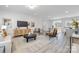 Spacious living room showcasing an open layout, modern furniture, and natural light with views to the dining area at 120 Random Dr, Salisbury, NC 28147