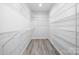 Spacious walk-in closet featuring ample shelving and modern flooring at 120 Random Dr, Salisbury, NC 28147