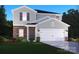 Charming two-story home featuring brick accents, neutral siding, a two-car garage, and inviting landscaping at 139 Aberdeen Dr, Salisbury, NC 28144
