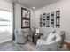 Inviting sitting area with comfortable armchairs, elegant decor, and a cozy atmosphere at 1401 Windy Park Dr, Stanley, NC 28164