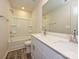 Bright bathroom featuring a double sink vanity with white cabinets and quartz countertops, plus a shower-tub combo at 151 Aberdeen Dr, Salisbury, NC 28144