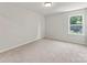 Bedroom featuring plush neutral carpeting, light walls, and a window providing natural light at 163 Stonewater Dr # 4P, Red Cross, NC 28129