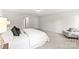 A bedroom featuring neutral carpet, light walls, access to the hallway, and a chair in the corner at 163 Stonewater Dr # 4P, Red Cross, NC 28129