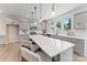 Spacious kitchen with a center island, pendant lighting, gray cabinets, and stainless steel appliances at 163 Stonewater Dr # 4P, Red Cross, NC 28129