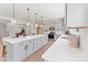 Bright, open kitchen featuring a large island with quartz countertops and stainless steel appliances, perfect for entertaining at 163 Stonewater Dr # 4P, Red Cross, NC 28129