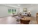 Bright living room featuring large windows, hardwood floors, and comfortable seating, creating a relaxing space at 163 Stonewater Dr # 4P, Red Cross, NC 28129