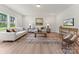 Cozy living room with hardwood floors, neutral decor, and ample natural light, creating a welcoming atmosphere at 163 Stonewater Dr # 4P, Red Cross, NC 28129