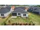 An aerial view of the rear of a home with an open back yard and screened-in porch at 1726 Riverbend Ave # 177, Belmont, NC 28012