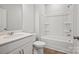 Well-lit bathroom with a single sink vanity, toilet, and combination tub/shower at 1726 Riverbend Ave # 177, Belmont, NC 28012
