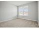 Clean, carpeted bedroom with large windows offering ample natural light at 1726 Riverbend Ave # 177, Belmont, NC 28012